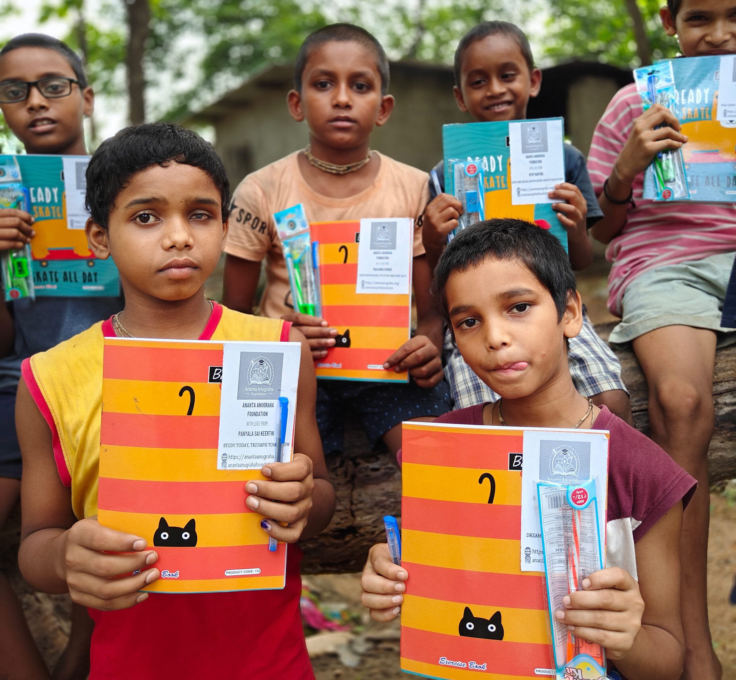 UNDERPRIVILEGED CHILDREN RECIEVING EDUCATION KITS